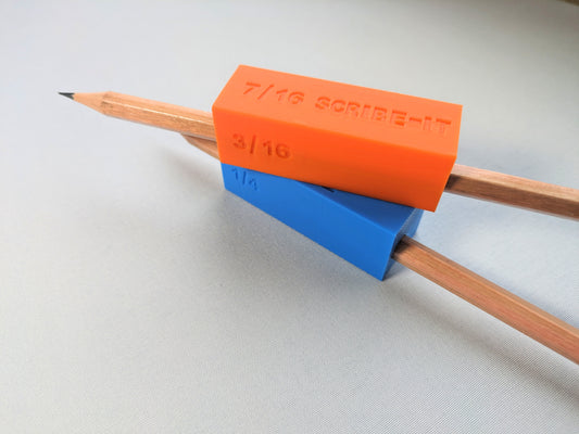 An orange woodworking Scribe-It scribe tool stacked on top of a blue one, each with a pencil inside.